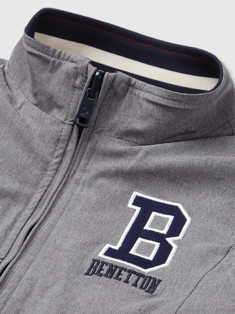 REVERSIBLE JACKET WITH AOP AND BADGE image number null