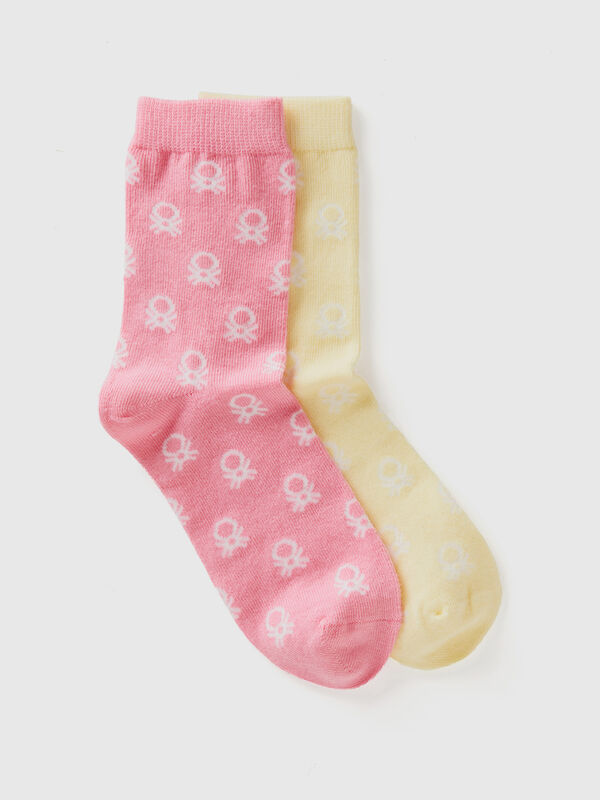 Two pairs of long yellow and pink socks Junior Boy