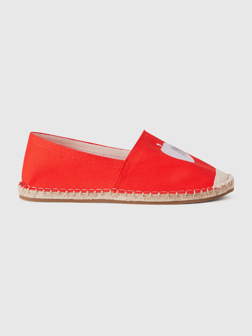 Red espadrilles with apple pattern
