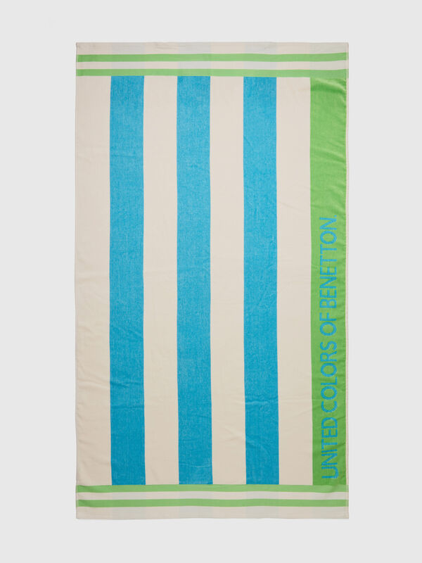 Beach towel with white and sky blue stripes